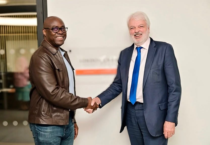 InvestAfrica leadership shaking hands with a UK institutional partner at the London Chamber of Commerce